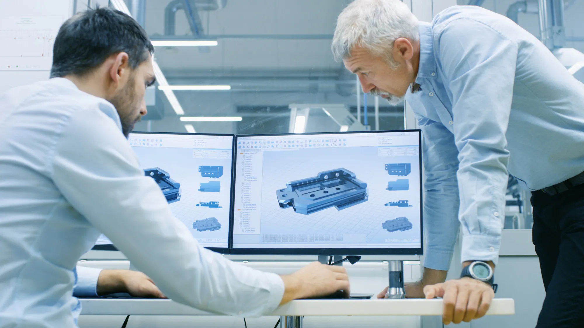 Engineers discussing technical blueprints and drawings